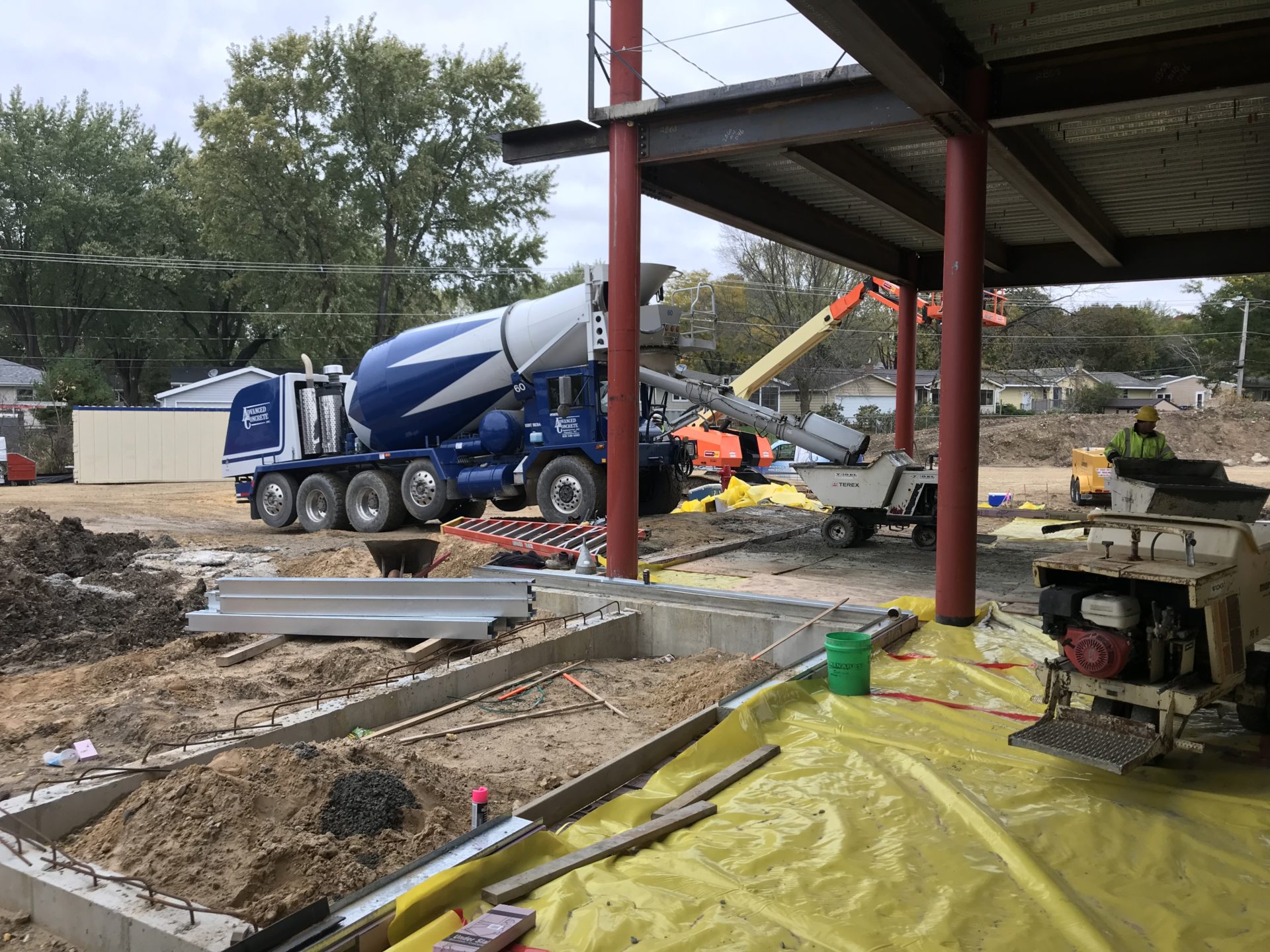 Concrete truck pouring fiber concrete on job site